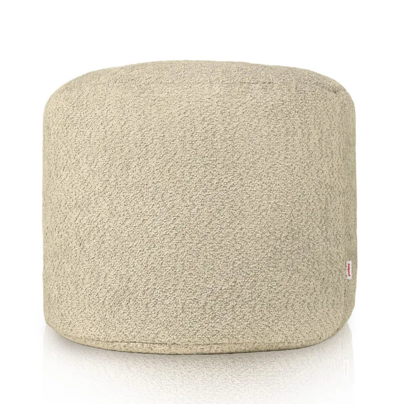 Práctico puff cilindro beige, ideal para cualquier rincón del hogar