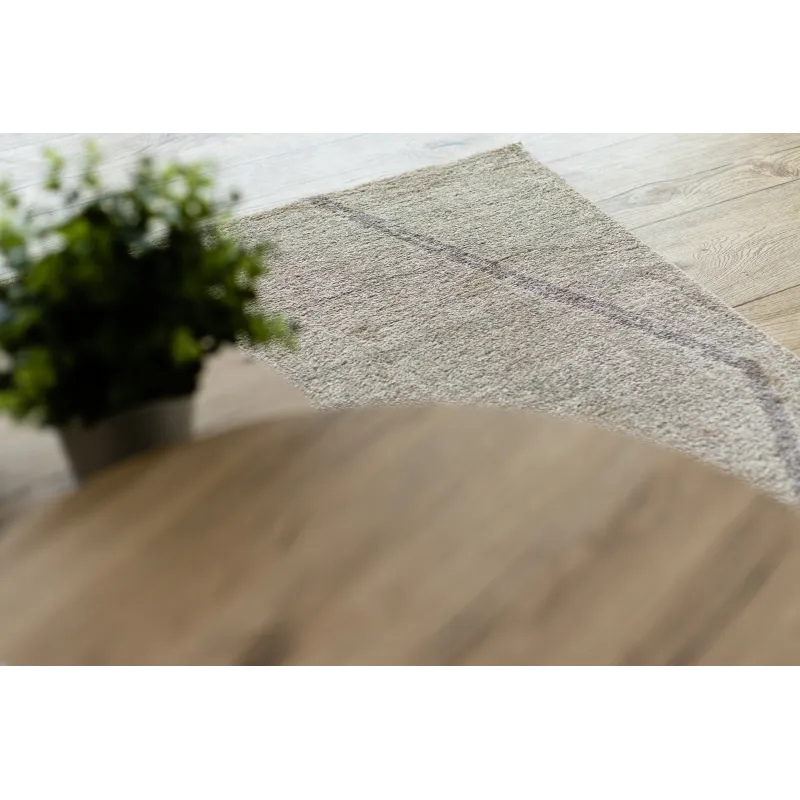 Alfombra crema con diseño étnico, ideal para interiores modernos