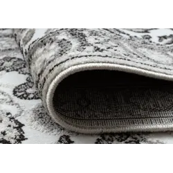 Alfombra acogedora en gris y beige, adecuada para cualquier espacio