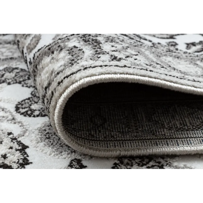 Alfombra acogedora en gris y beige, adecuada para cualquier espacio