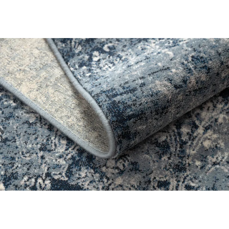 Alfombra vintage azul oscuro y beige, perfecta para decorar el salón
