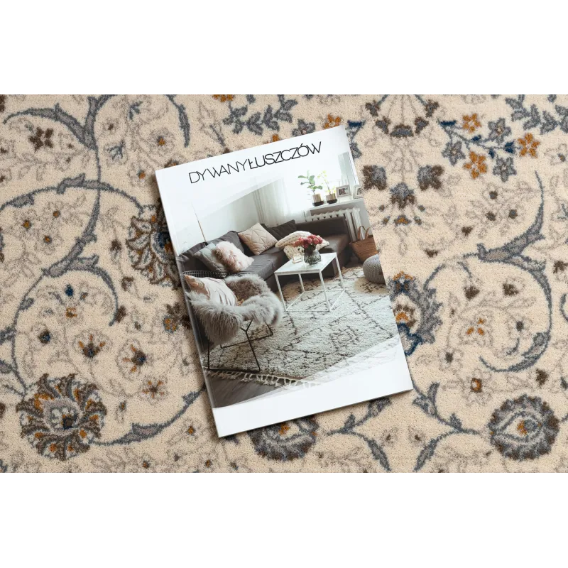 Alfombra elegante en tonos beige y azul, ideal para interiores modernos