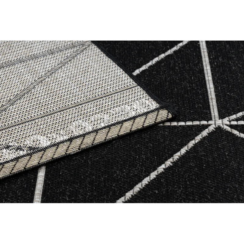 Alfombra de sisal texturizada negra y plateada, que aporta elegancia a cualquier espacio